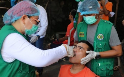 <p><strong>DENTAL CARE.</strong> An inmate gets a tooth extraction from a dentist during a medical mission conducted on Wednesday (April 18) by the Maguindanao provincial government at its provincial jail situated at Pedro Colina Hill in Cotabato City. <em><strong>(Photo by Maguindanao PIO)</strong></em></p>
